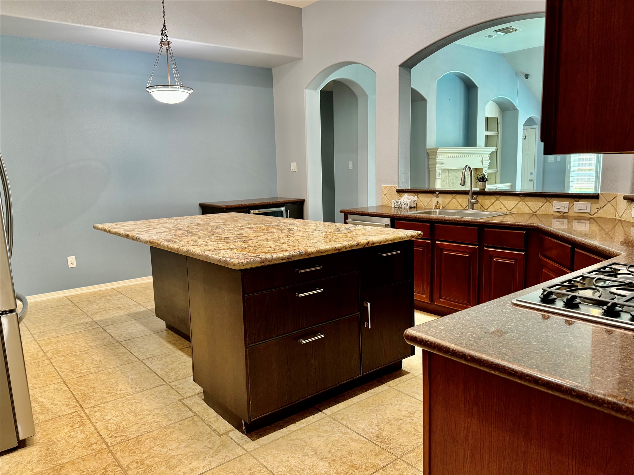 15434 Bay Tree Landing Cypress, TX 77429 - Photo 11 of 39 a kitchen with a sink a stove and cabinets