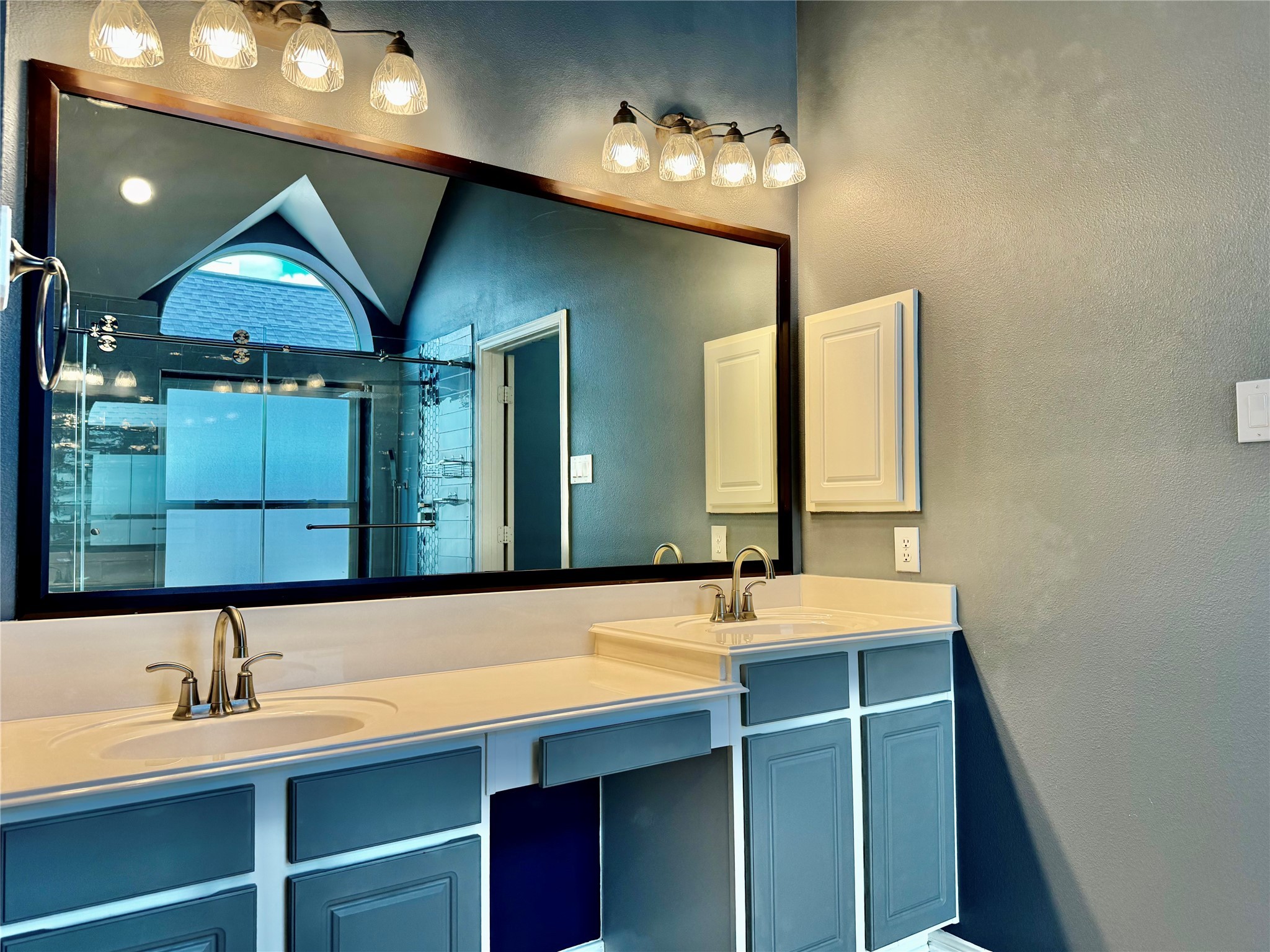 15434 Bay Tree Landing Cypress, TX 77429 - Photo 17 of 39 a bathroom with a sink and a mirror