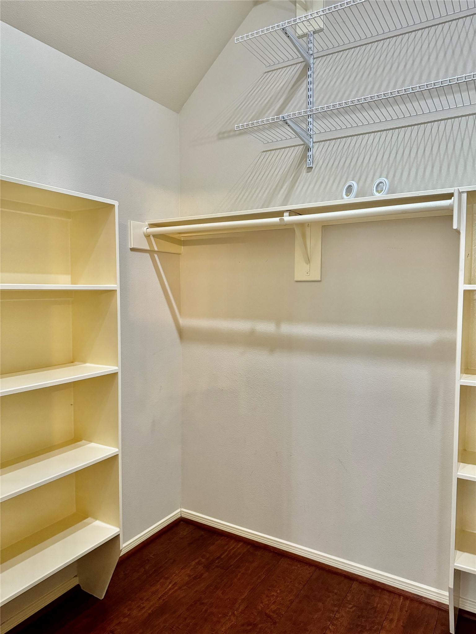15434 Bay Tree Landing Cypress, TX 77429 - Photo 19 of 39 a view of walk in closet with empty racks