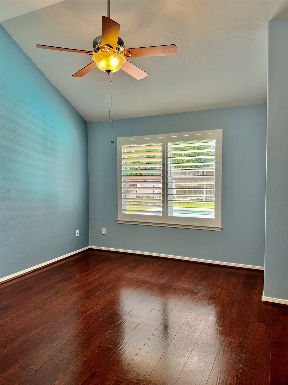 15434 Bay Tree Landing Cypress, TX 77429 - Photo 21 of 39 a view of an empty room with wooden floor and a window