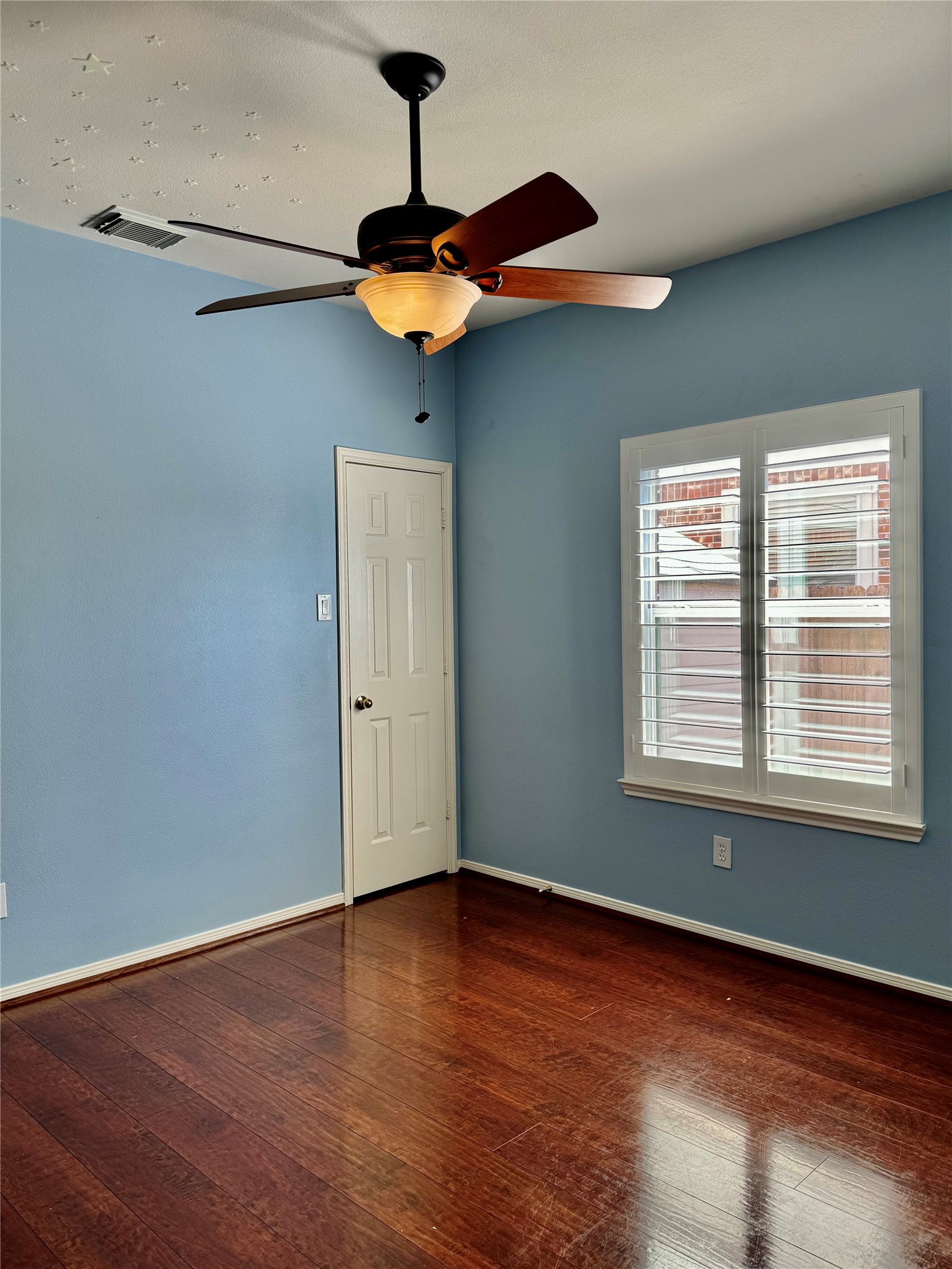 15434 Bay Tree Landing Cypress, TX 77429 - Photo 22 of 39 a view of a room with a window and wooden floor