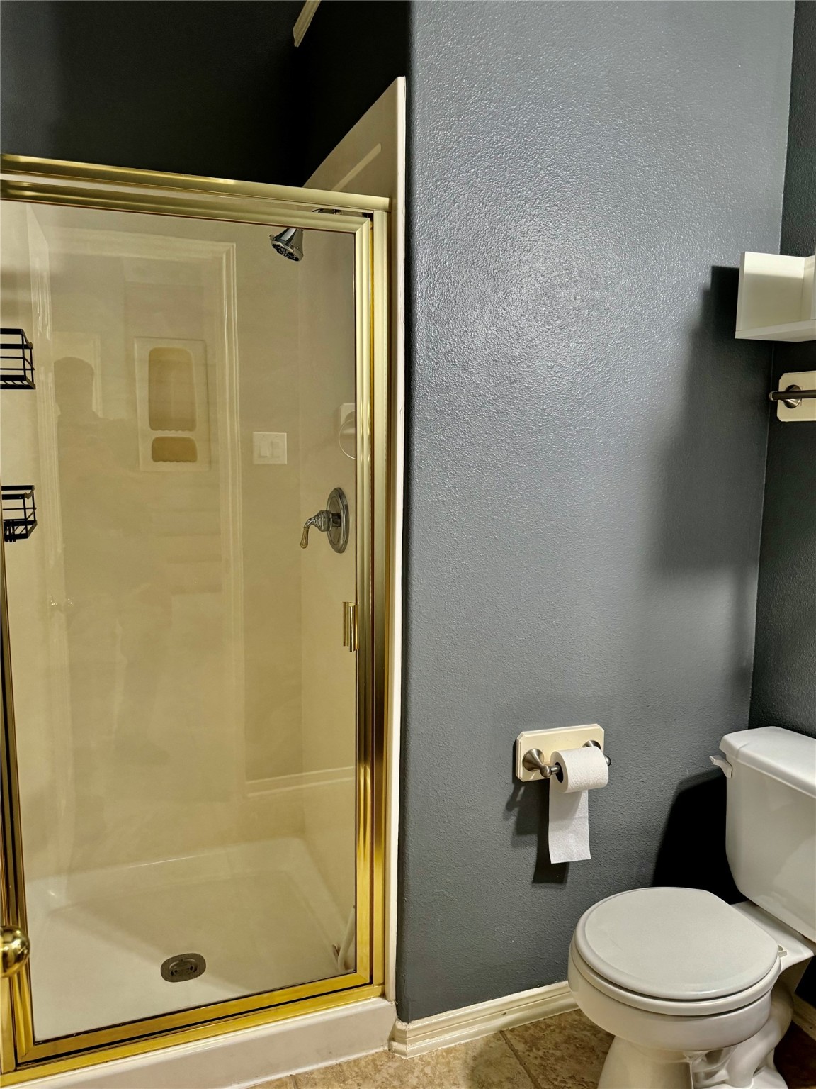 15434 Bay Tree Landing Cypress, TX 77429 - Photo 26 of 39 a white toilet sitting next to a bathroom shower