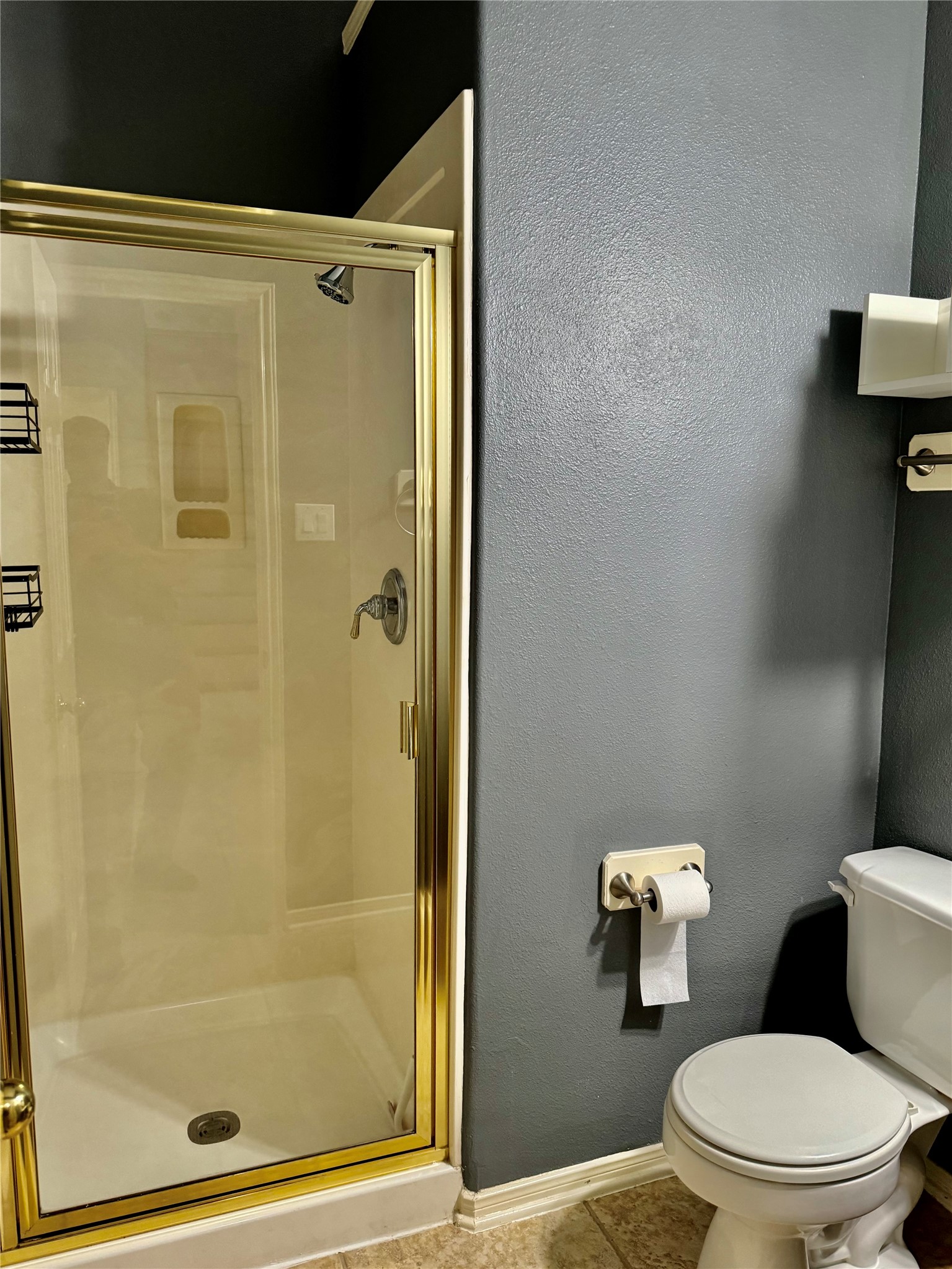 15434 Bay Tree Landing Cypress, TX 77429 - Photo 26 of 39 a white toilet sitting next to a bathroom shower