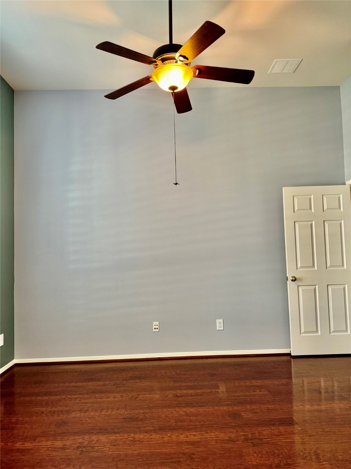 15434 Bay Tree Landing Cypress, TX 77429 - Photo 5 of 39 a view of an empty room with wooden floor