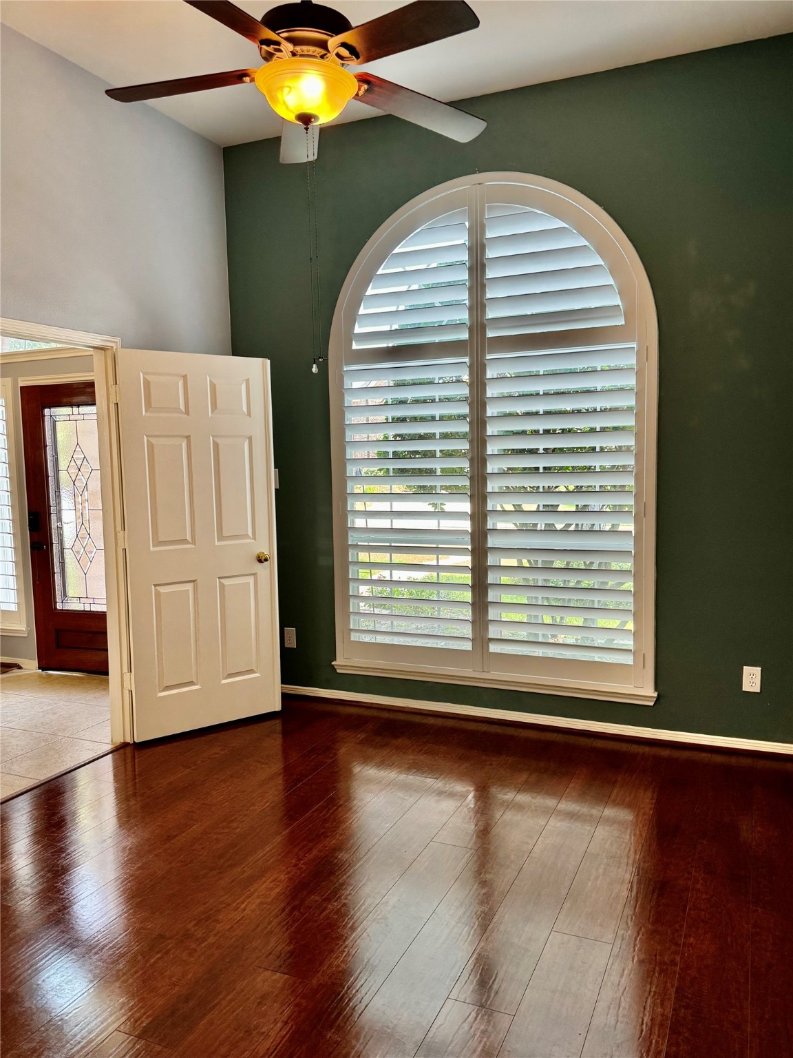 15434 Bay Tree Landing Cypress, TX 77429 - Photo 6 of 39 an empty room with wooden floor and windows