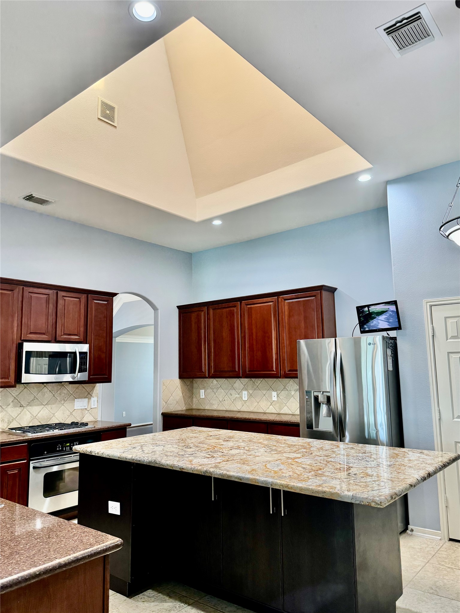 15434 Bay Tree Landing Cypress, TX 77429 - Photo 9 of 39 a kitchen with stainless steel appliances wooden cabinets a refrigerator and a stove
