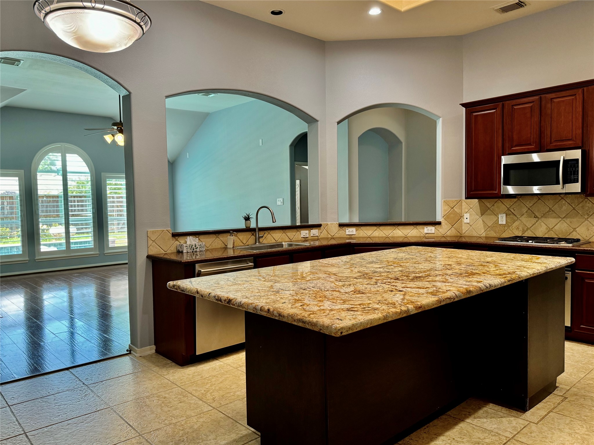15434 Bay Tree Landing Cypress, TX 77429 - Photo 10 of 39 a bathroom with a granite countertop sink and a mirror
