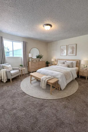 a bedroom with a bed and window
