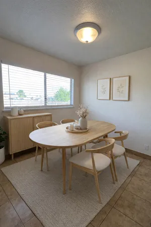 a view of a dining room with furniture window and outside view