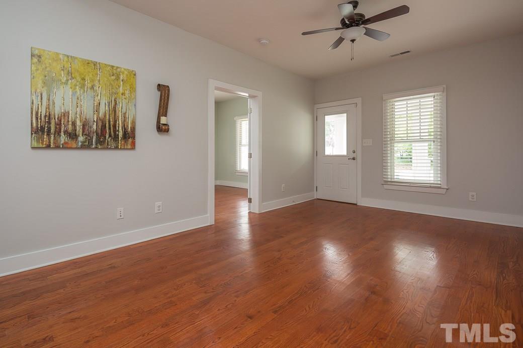 904 East Edenton Street Raleigh, NC 27601 - Photo 11 of 11 a view of an empty room with wooden floor and window
