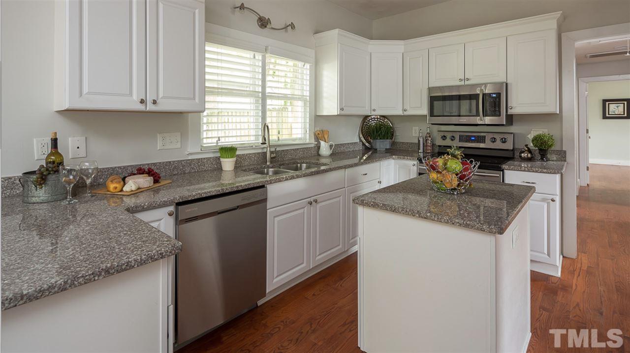 904 East Edenton Street Raleigh, NC 27601 - Photo 2 of 11 a kitchen with granite countertop a sink stove and microwave