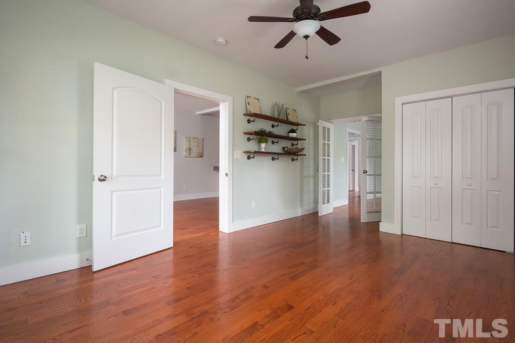 904 East Edenton Street Raleigh, NC 27601 - Photo 4 of 11 a view of a room with wooden floor and ceiling fan