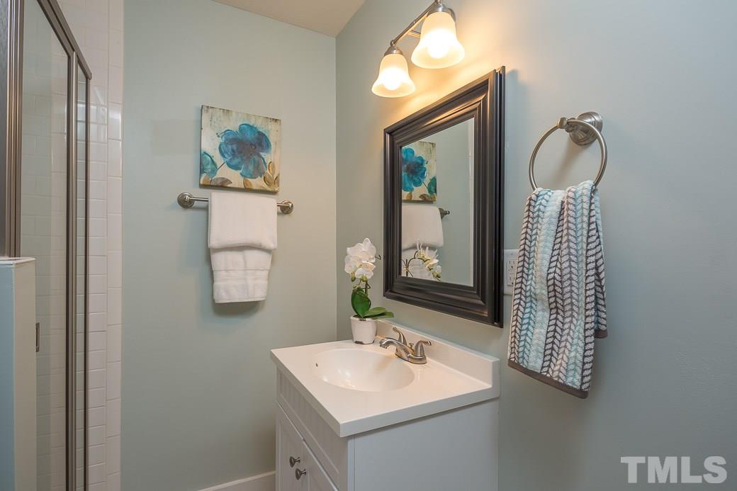 904 East Edenton Street Raleigh, NC 27601 - Photo 7 of 11 a bathroom with mirror and a sink