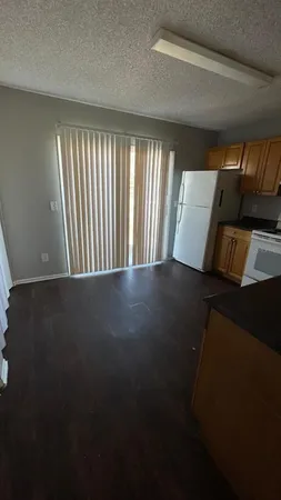 a view of a room with furniture and a window