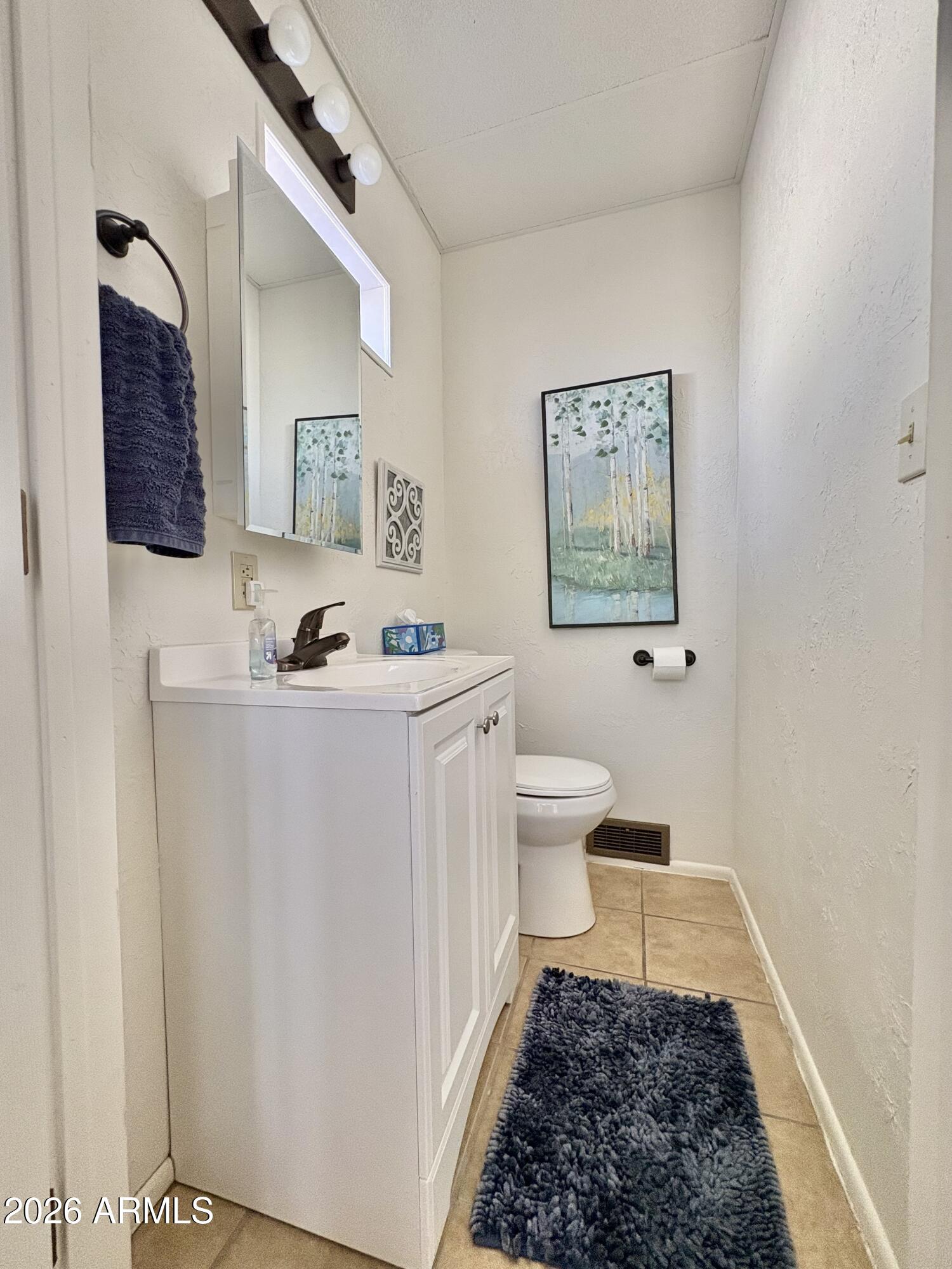 111 South Greenfield Road, Unit 589 Mesa, AZ 85206 - Photo 13 of 54 a bath room with a toilet and a shower