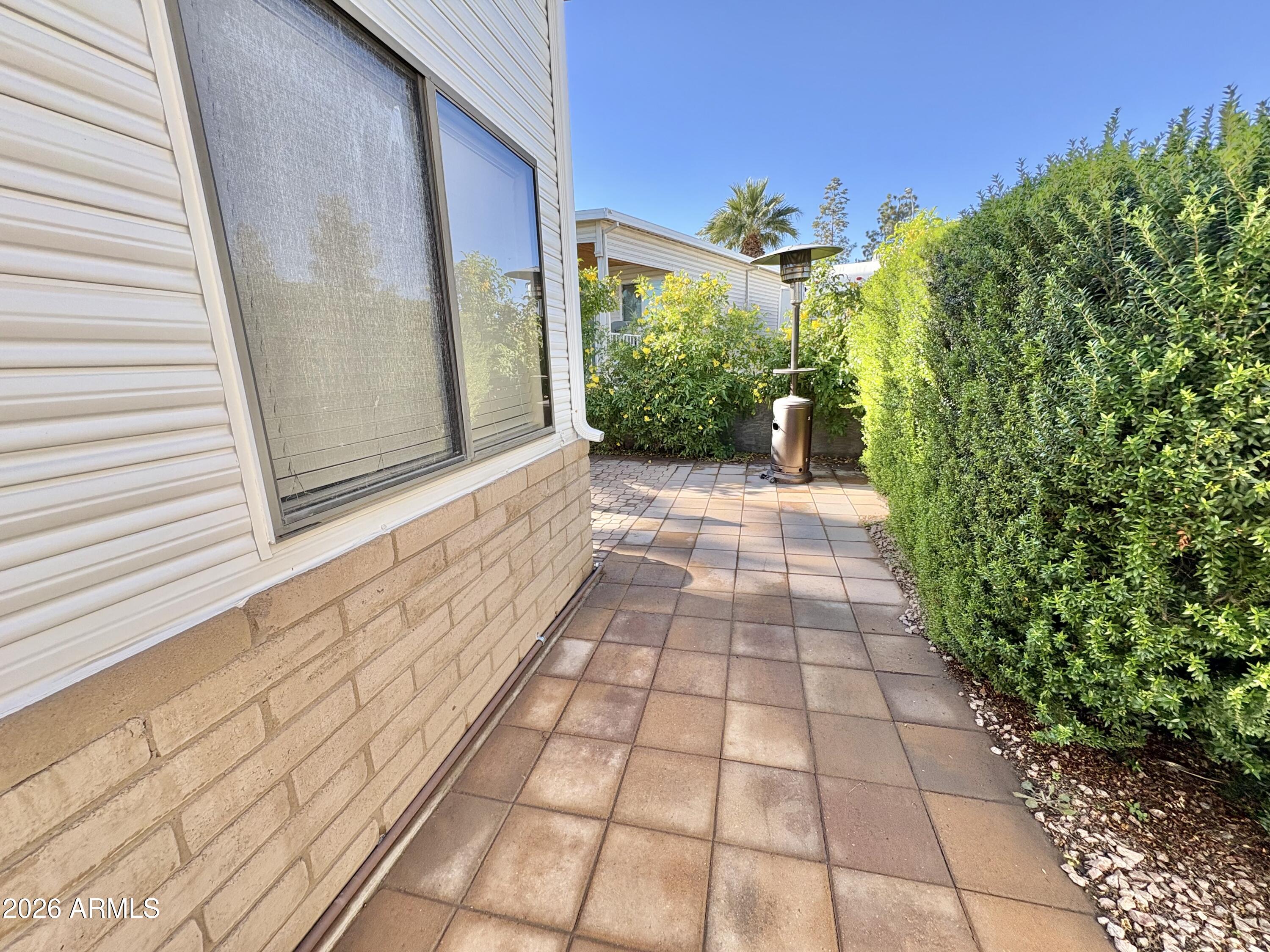 111 South Greenfield Road, Unit 589 Mesa, AZ 85206 - Photo 29 of 54 a view of a pathway both side of the house