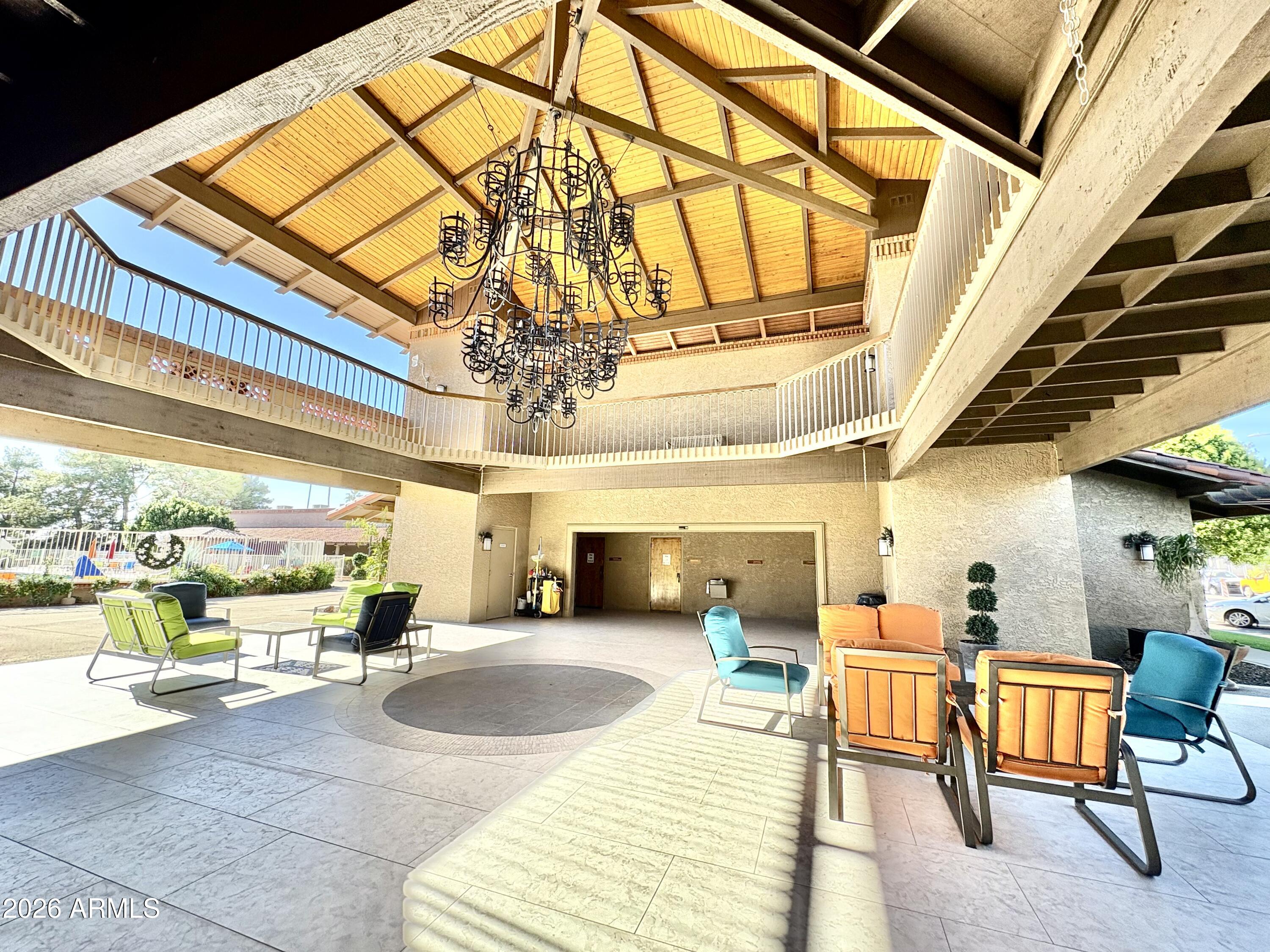 111 South Greenfield Road, Unit 589 Mesa, AZ 85206 - Photo 36 of 54 a lobby with furniture and a floor to ceiling window