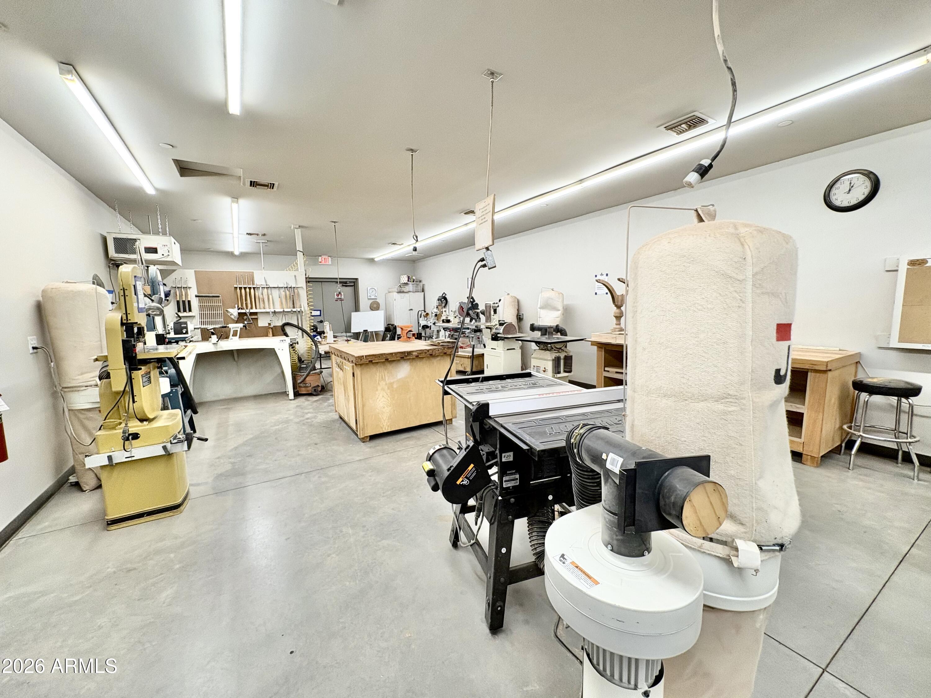 111 South Greenfield Road, Unit 589 Mesa, AZ 85206 - Photo 49 of 54 a living room with lots of furniture and white appliances