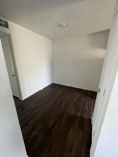 1101 Bois D'Arc Street, Unit D Lockhart, TX 78644 - Photo 3 of 8 a view of wooden floor