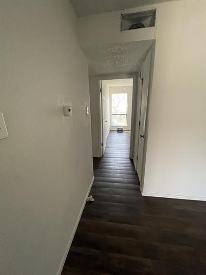 1101 Bois D'Arc Street, Unit D Lockhart, TX 78644 - Photo 4 of 8 a view of a hallway with wooden floor