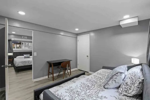 a bedroom with a bed and a view of bedroom