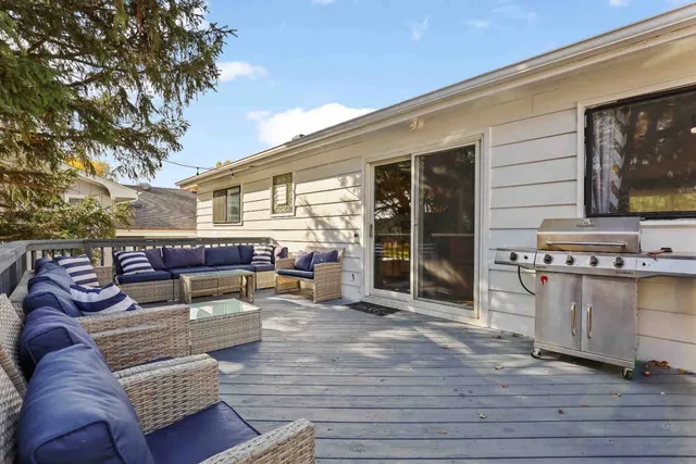 a outdoor living space with furniture and a flat screen tv