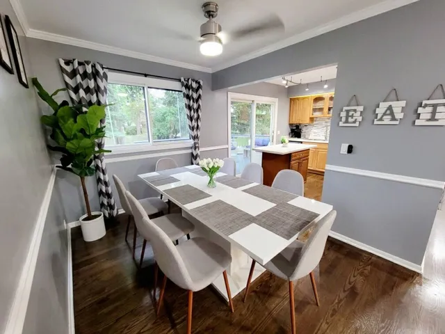 a view of a dining room with furniture window and wooden floor