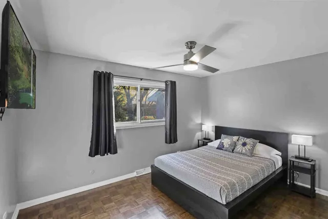 a bedroom with a bed and a window