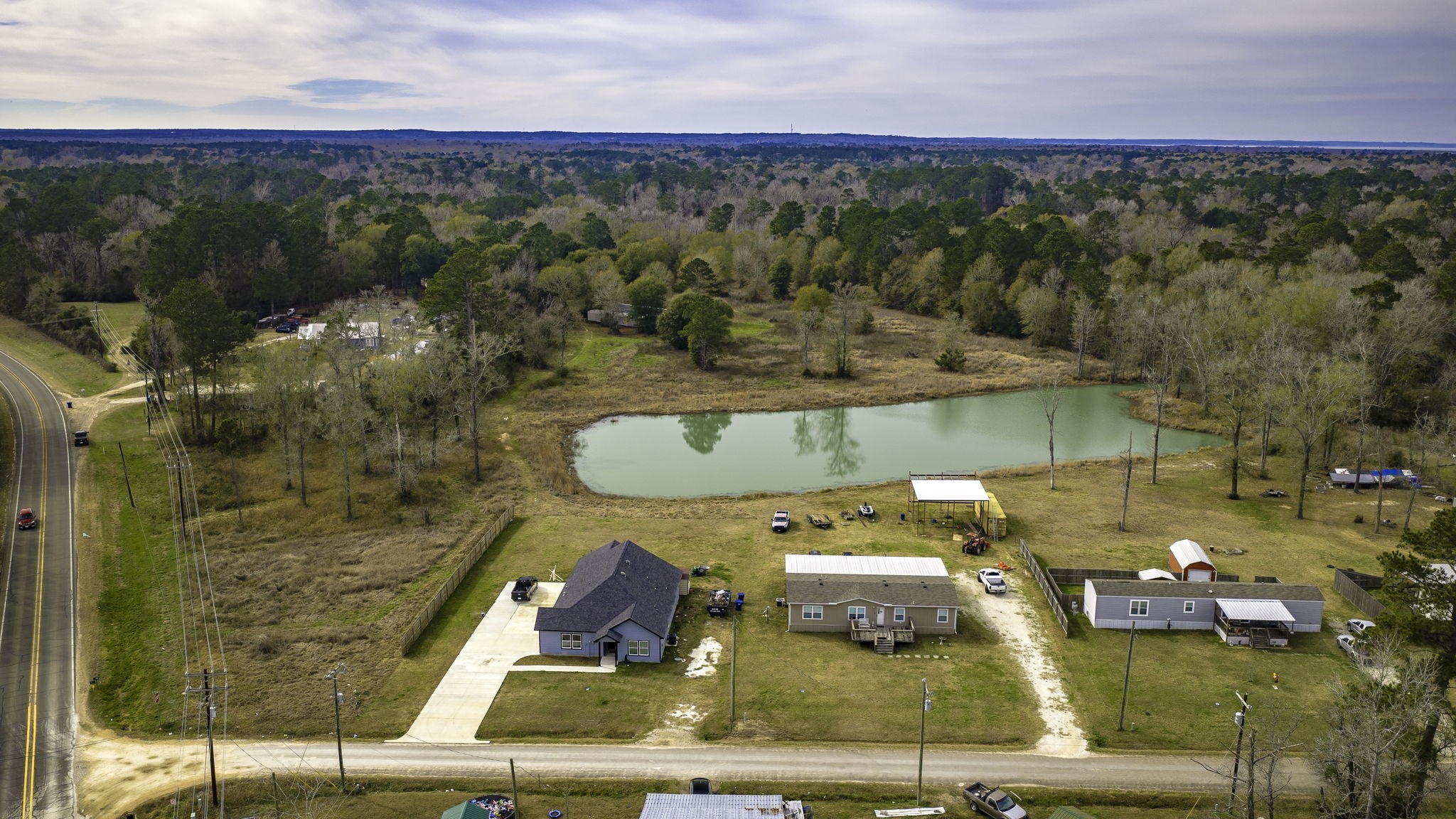 276 Hoot Owl Hollow Road Goodrich, TX 77335 - Photo 3 of 27 an aerial view of a house with a ocean view