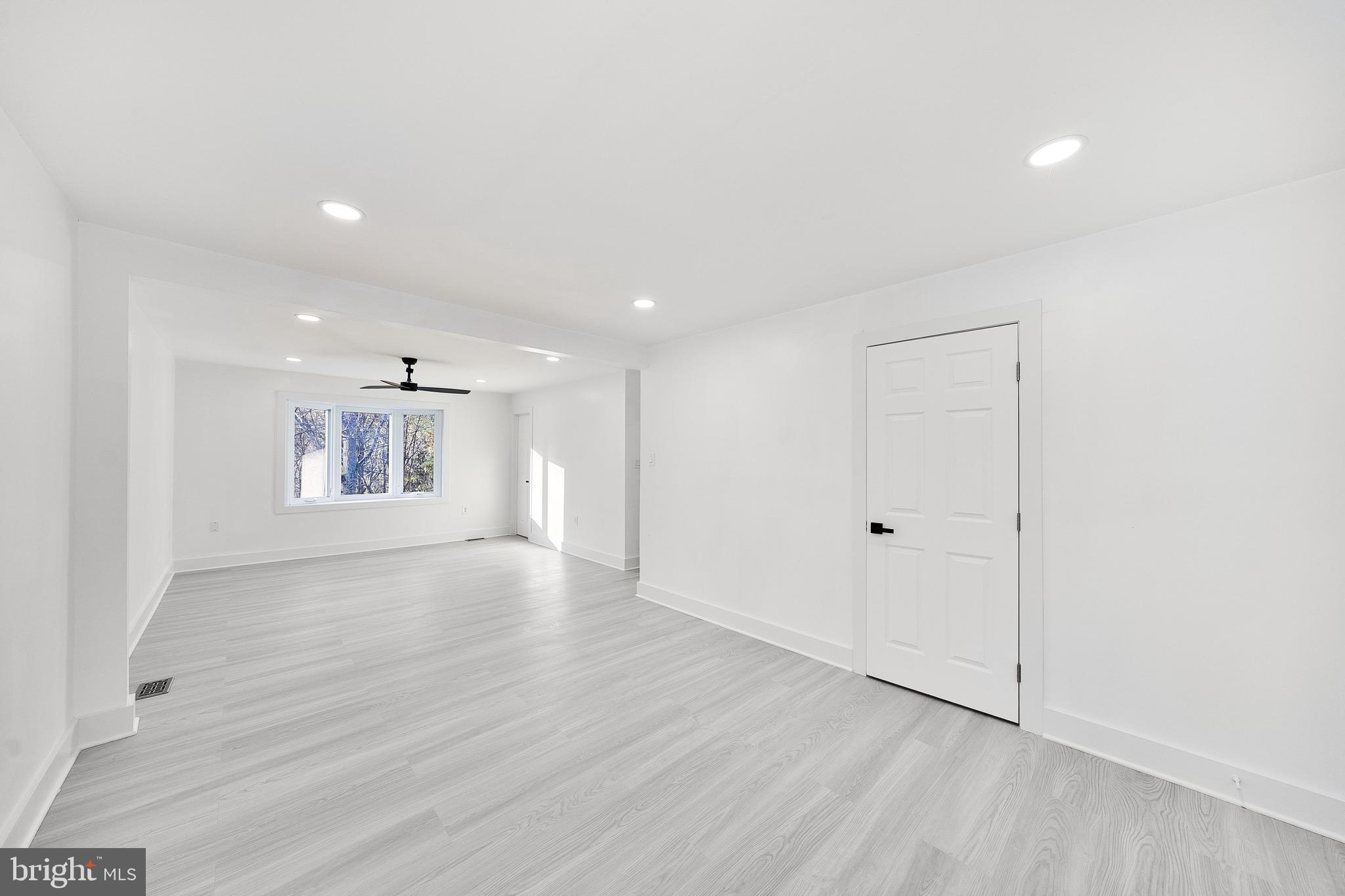 10916 Howland Drive Reston, VA 20191 - Photo 32 of 67 a view of an empty room with wooden floor
