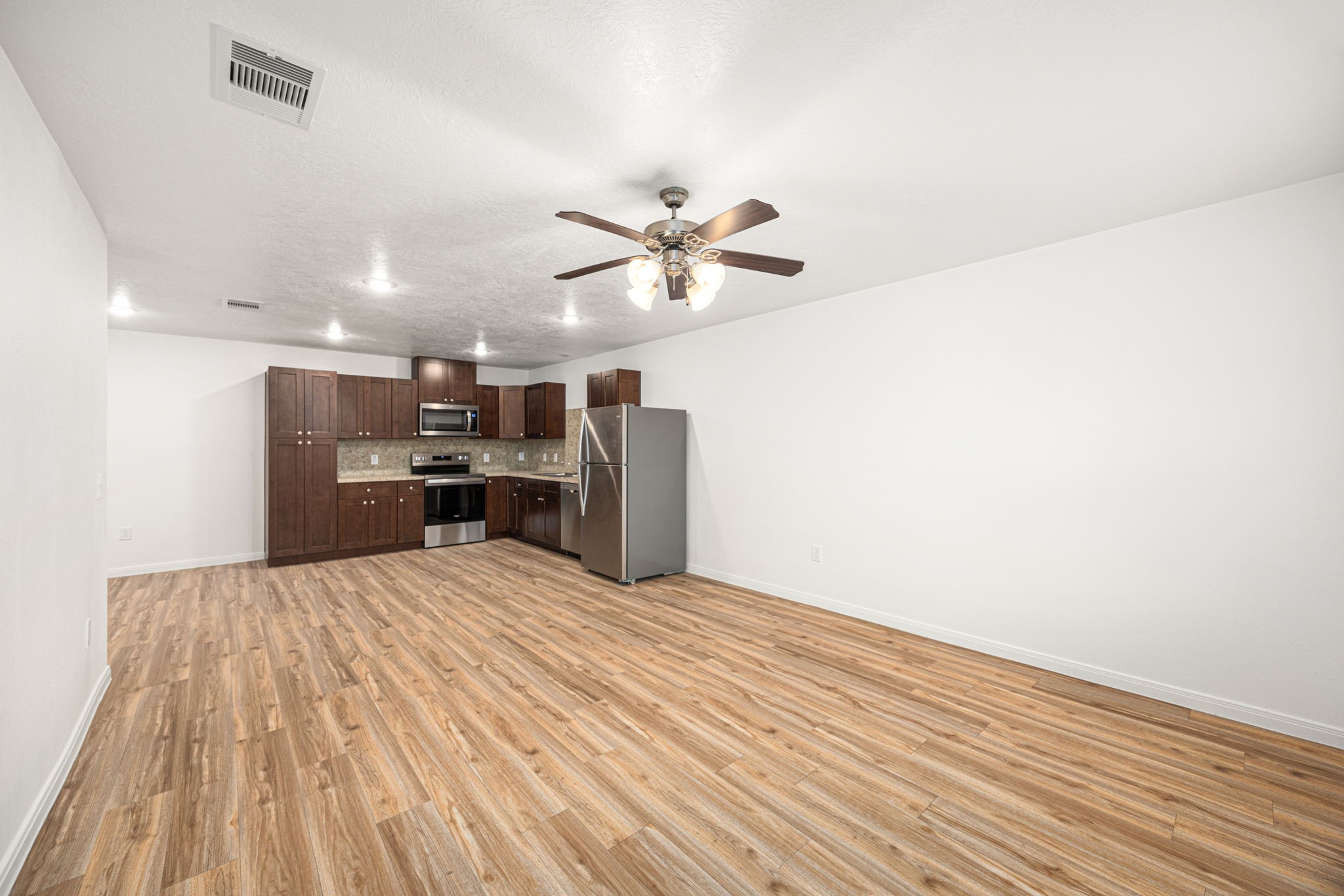 23507 Prairie Bird Drive Spring, TX 77373 - Photo 30 of 30 a view of kitchen and empty room with cabinet