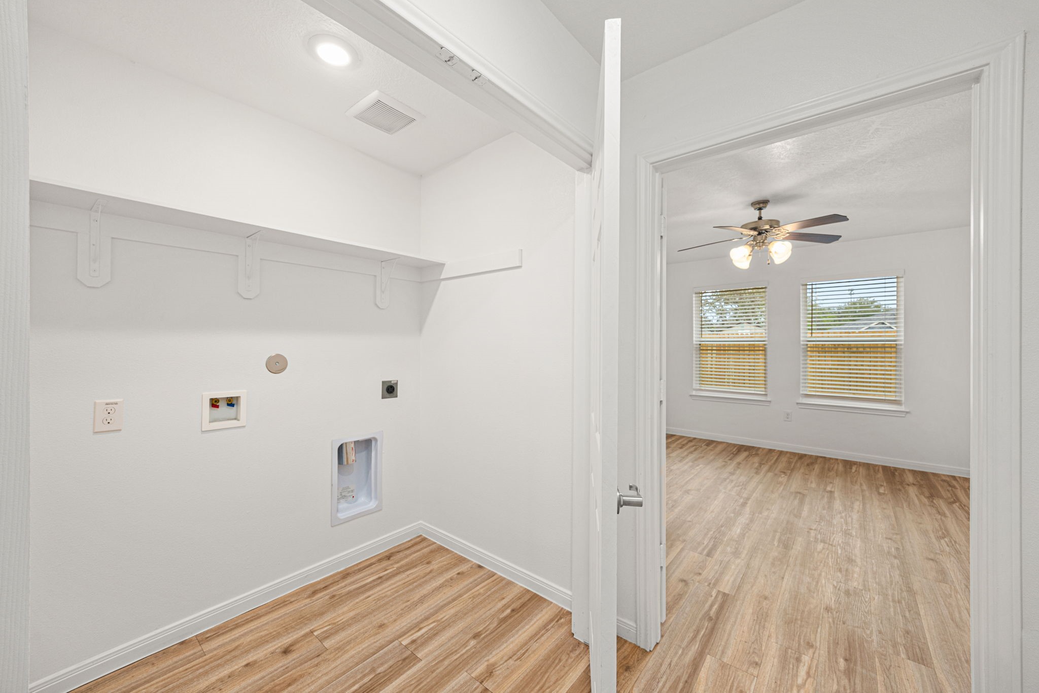 23507 Prairie Bird Drive Spring, TX 77373 - Photo 19 of 30 a view of empty room with wooden floor and fan