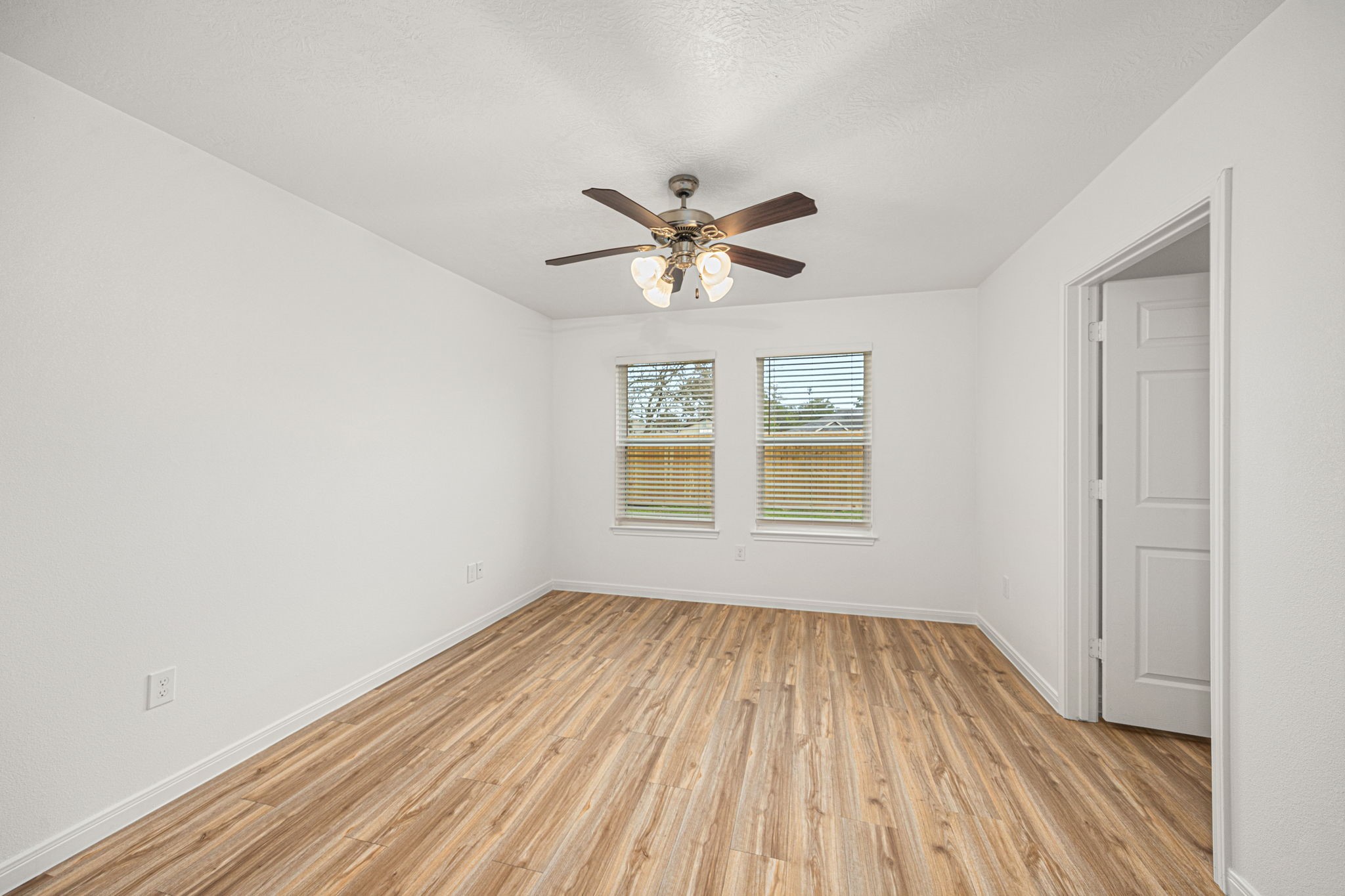 23507 Prairie Bird Drive Spring, TX 77373 - Photo 21 of 30 an empty room with a window and a ceiling fan