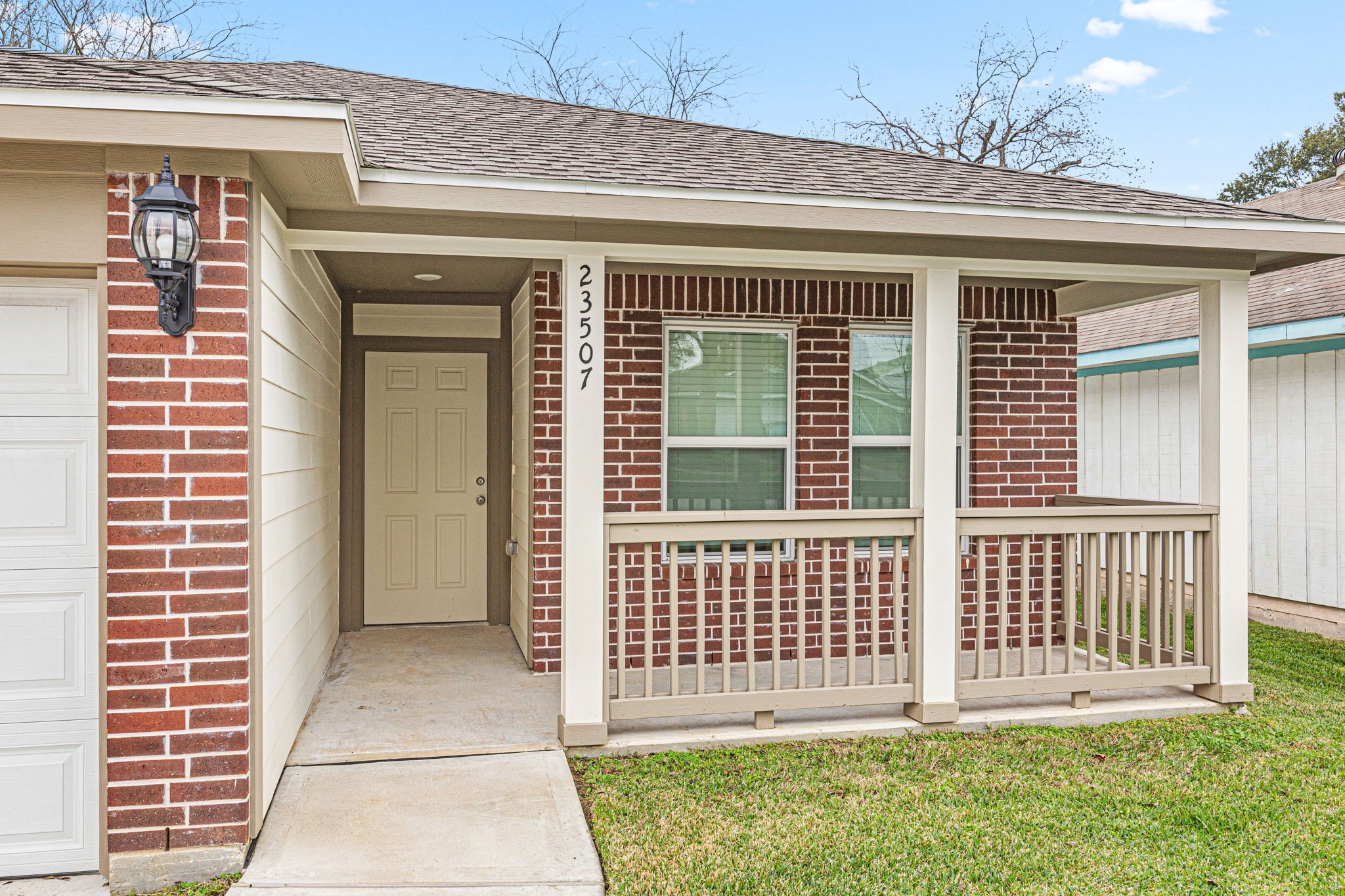 23507 Prairie Bird Drive Spring, TX 77373 - Photo 4 of 30 a view of a house with porch and wooden floor