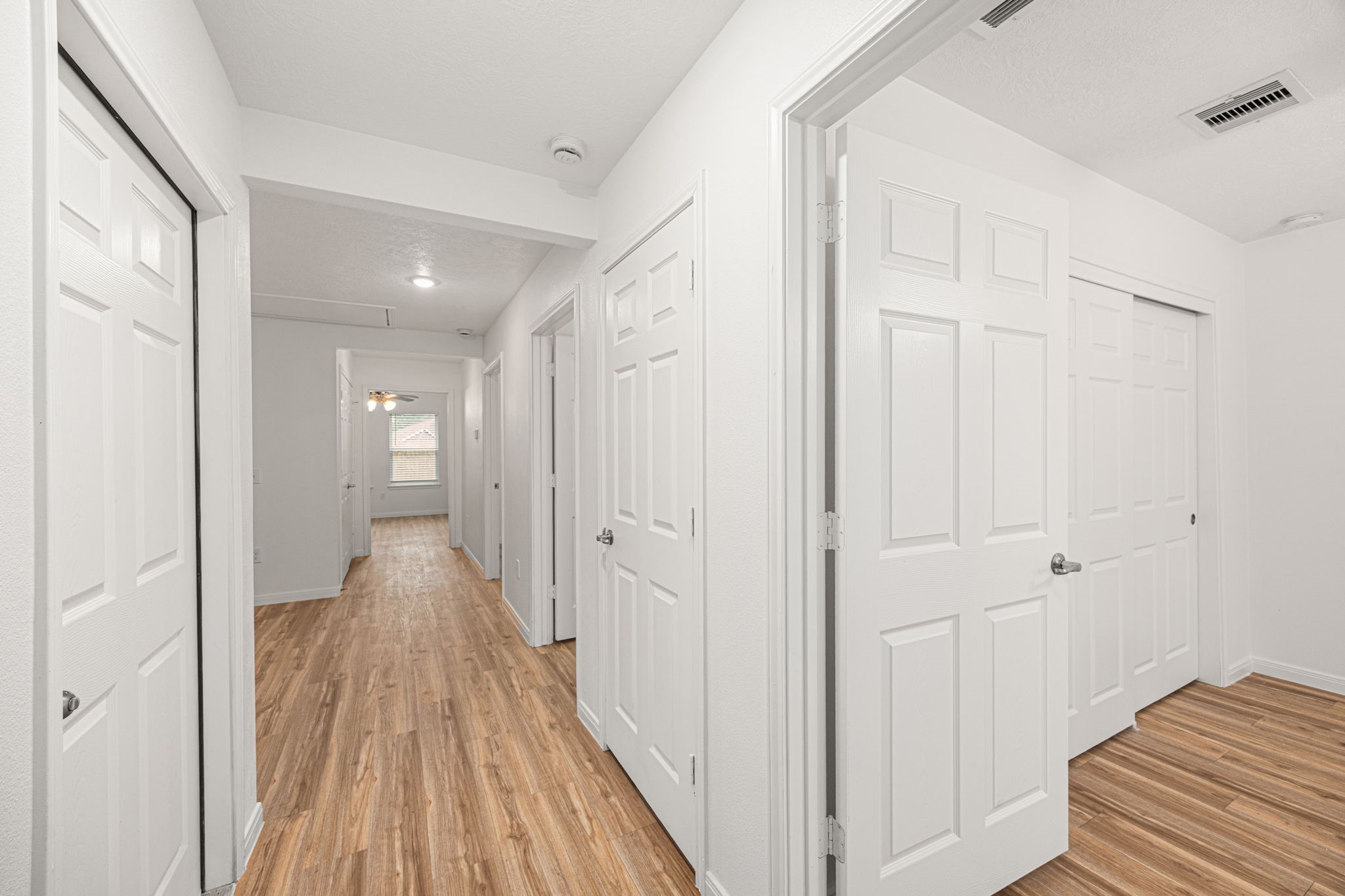 23507 Prairie Bird Drive Spring, TX 77373 - Photo 5 of 30 a view of a hallway with wooden floor
