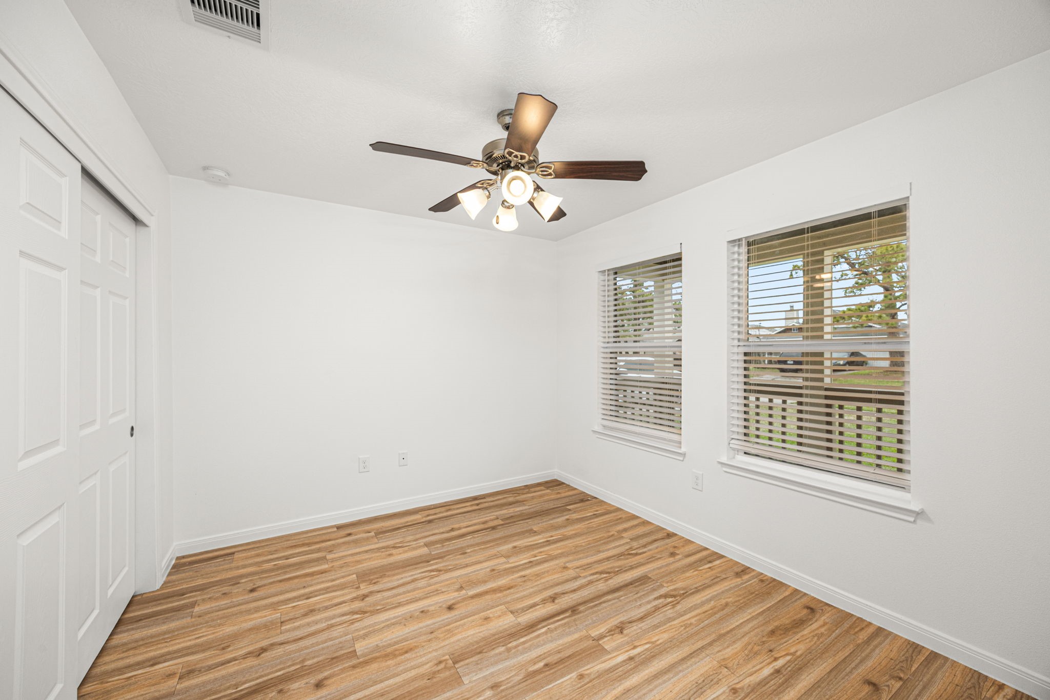 23507 Prairie Bird Drive Spring, TX 77373 - Photo 7 of 30 a view of a room with a window and wooden floor