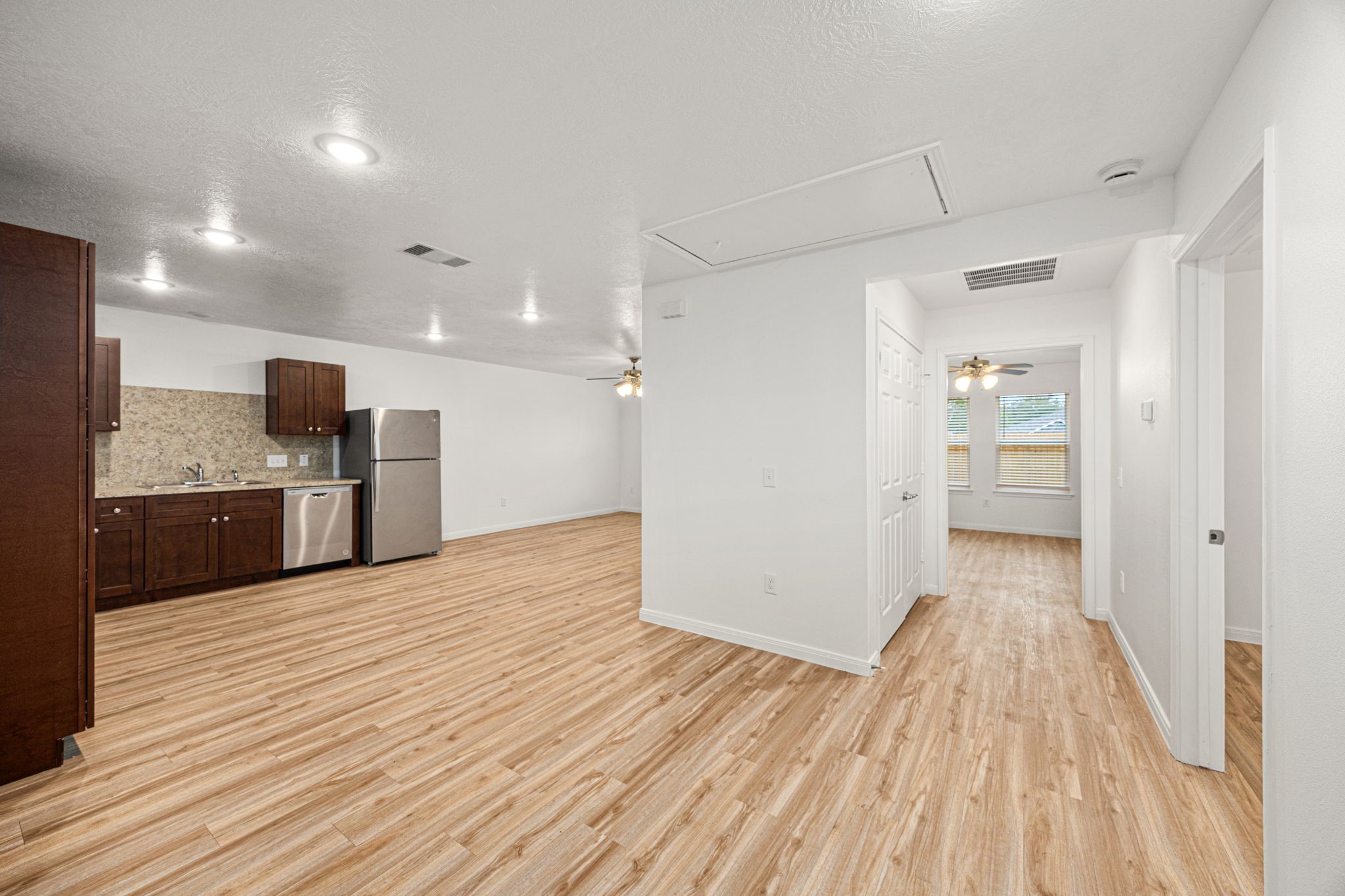 23507 Prairie Bird Drive Spring, TX 77373 - Photo 8 of 30 a view of a kitchen with wooden floor