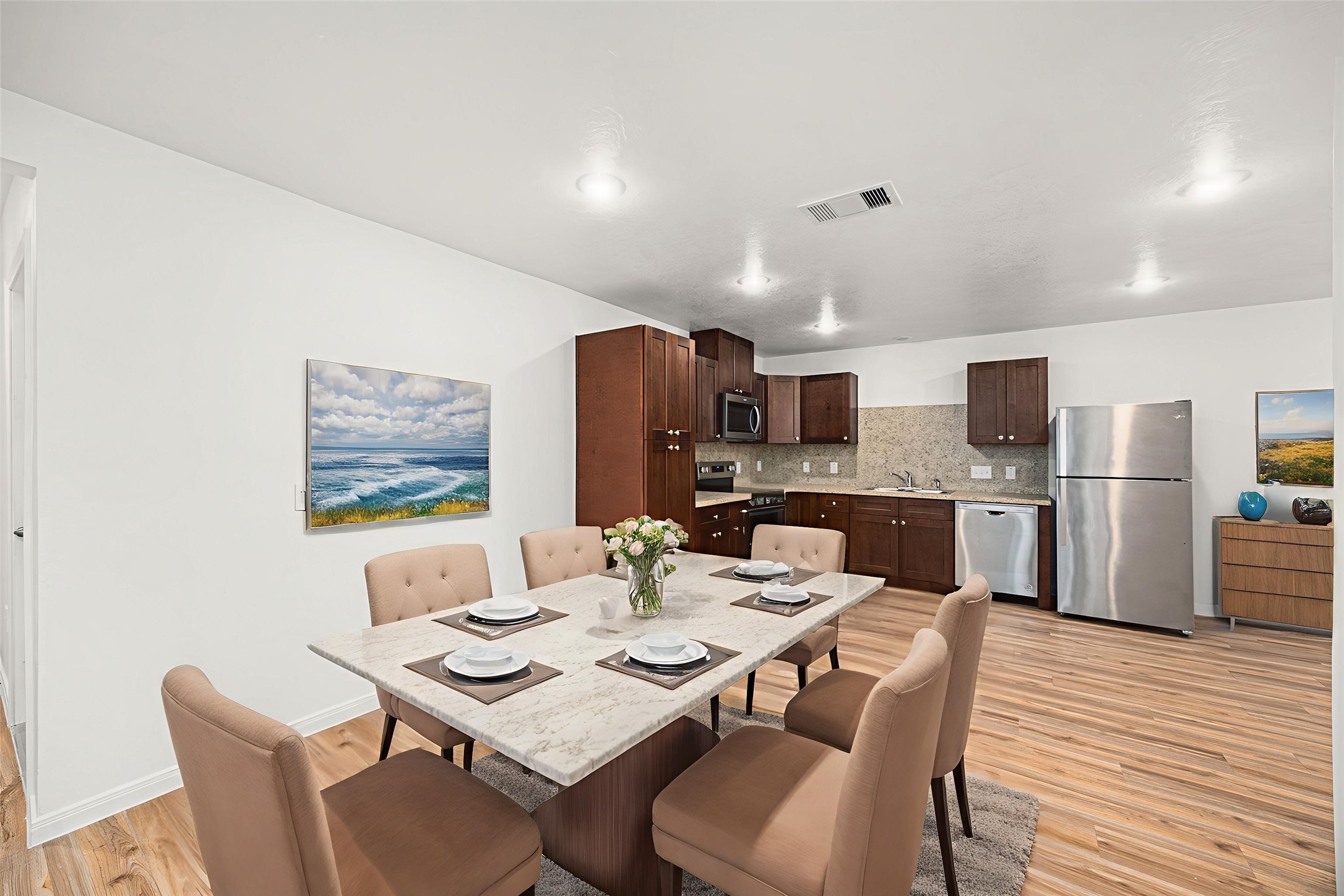 23507 Prairie Bird Drive Spring, TX 77373 - Photo 9 of 30 a dining room with stainless steel appliances kitchen island granite countertop a dining table and chairs