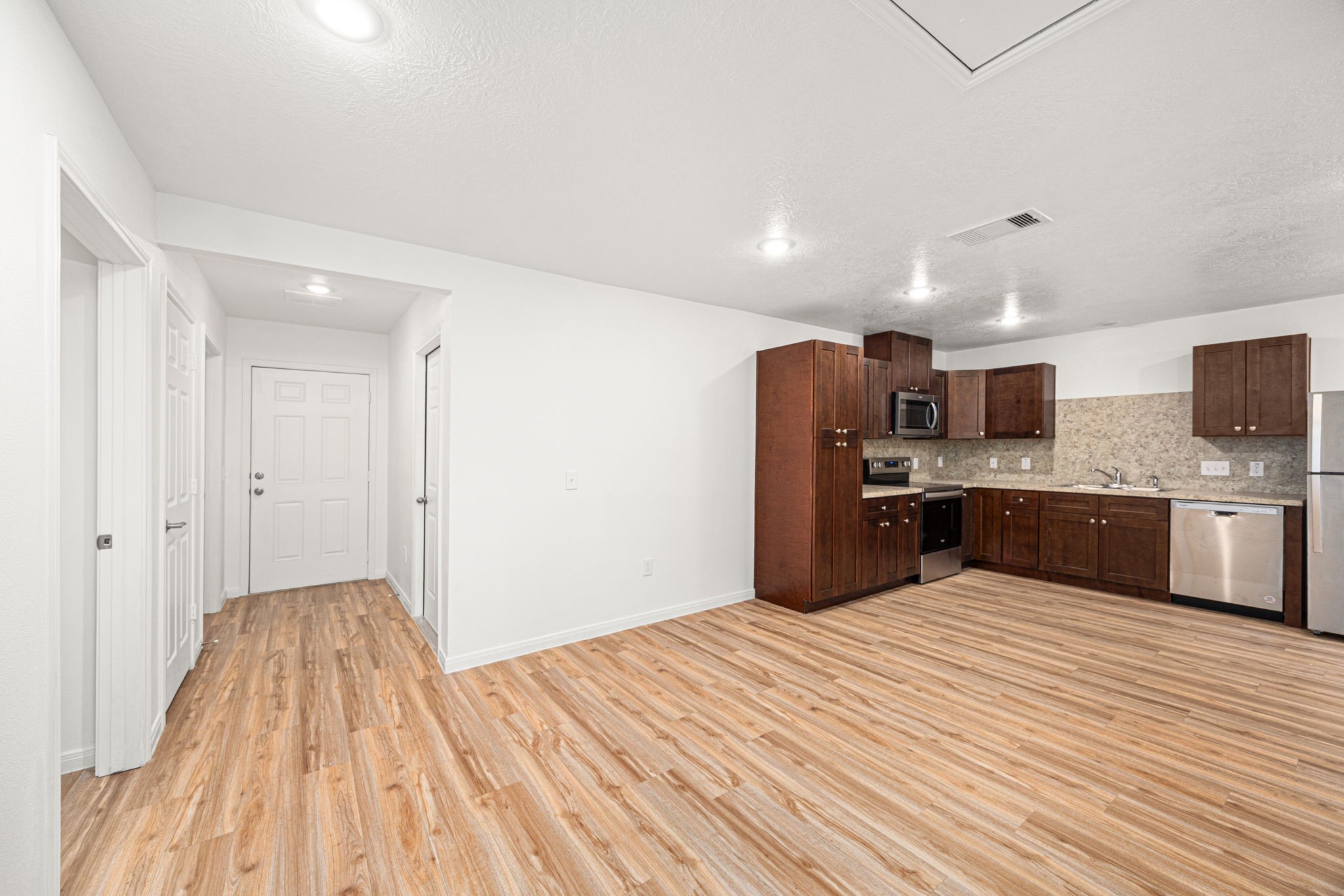 23507 Prairie Bird Drive Spring, TX 77373 - Photo 10 of 30 a kitchen with a refrigerator and a sink