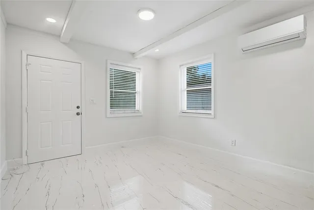 a view of an empty room with a window