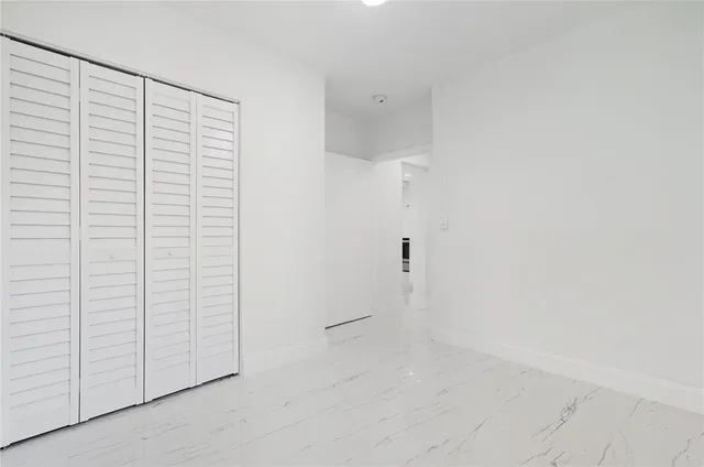 an empty room with cabinet