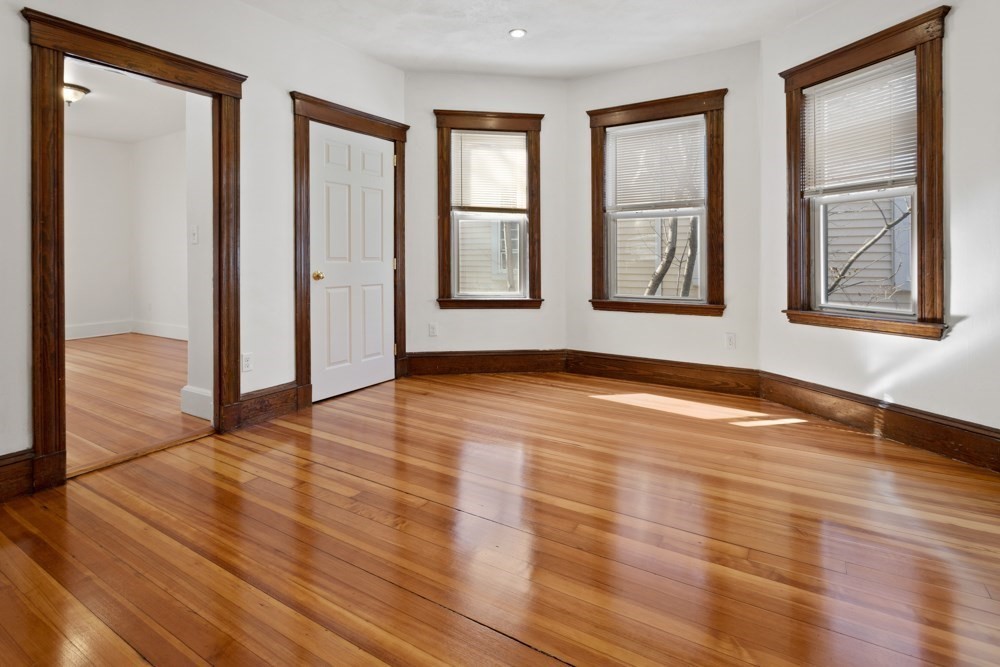87 Bailey Street, Unit 2 Boston, MA 02124 - Photo 11 of 18 a view of empty room with wooden floor and fan