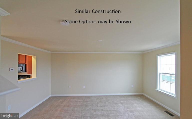 0 Rumbling Rock Road Hedgesville, WV 25427 - Photo 13 of 28 an empty room with windows