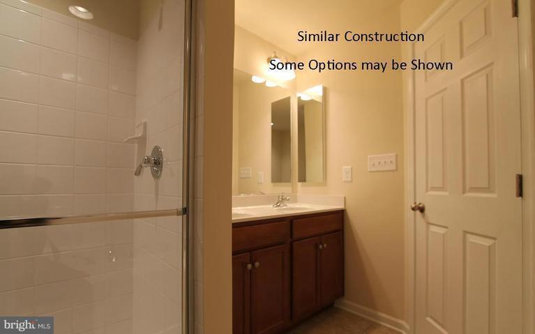 0 Rumbling Rock Road Hedgesville, WV 25427 - Photo 19 of 28 a bathroom with a shower and a sink