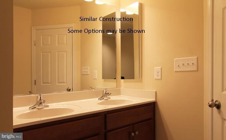 0 Rumbling Rock Road Hedgesville, WV 25427 - Photo 20 of 28 a bathroom with a sink and a mirror