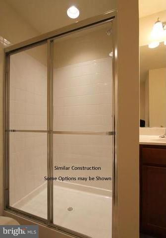 0 Rumbling Rock Road Hedgesville, WV 25427 - Photo 21 of 28 a bathroom with a shower and a sink