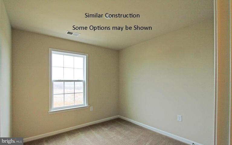 0 Rumbling Rock Road Hedgesville, WV 25427 - Photo 23 of 28 an empty room with a window