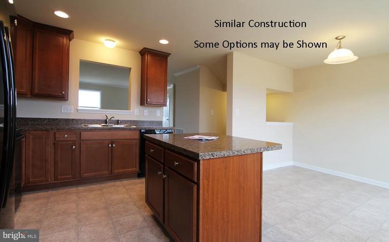 0 Rumbling Rock Road Hedgesville, WV 25427 - Photo 8 of 28 a kitchen with stainless steel appliances granite countertop a stove a sink and a microwave