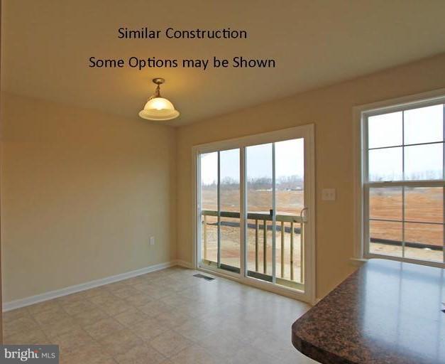 0 Rumbling Rock Road Hedgesville, WV 25427 - Photo 9 of 28 a view of an empty room with a window