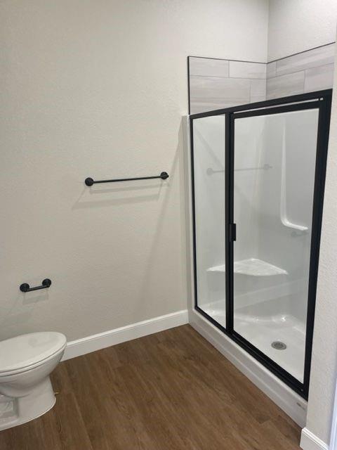 7326 Mountain View Road, Unit 7328 Abilene, TX 79602 - Photo 14 of 15 a bathroom with a toilet and a glass shower door